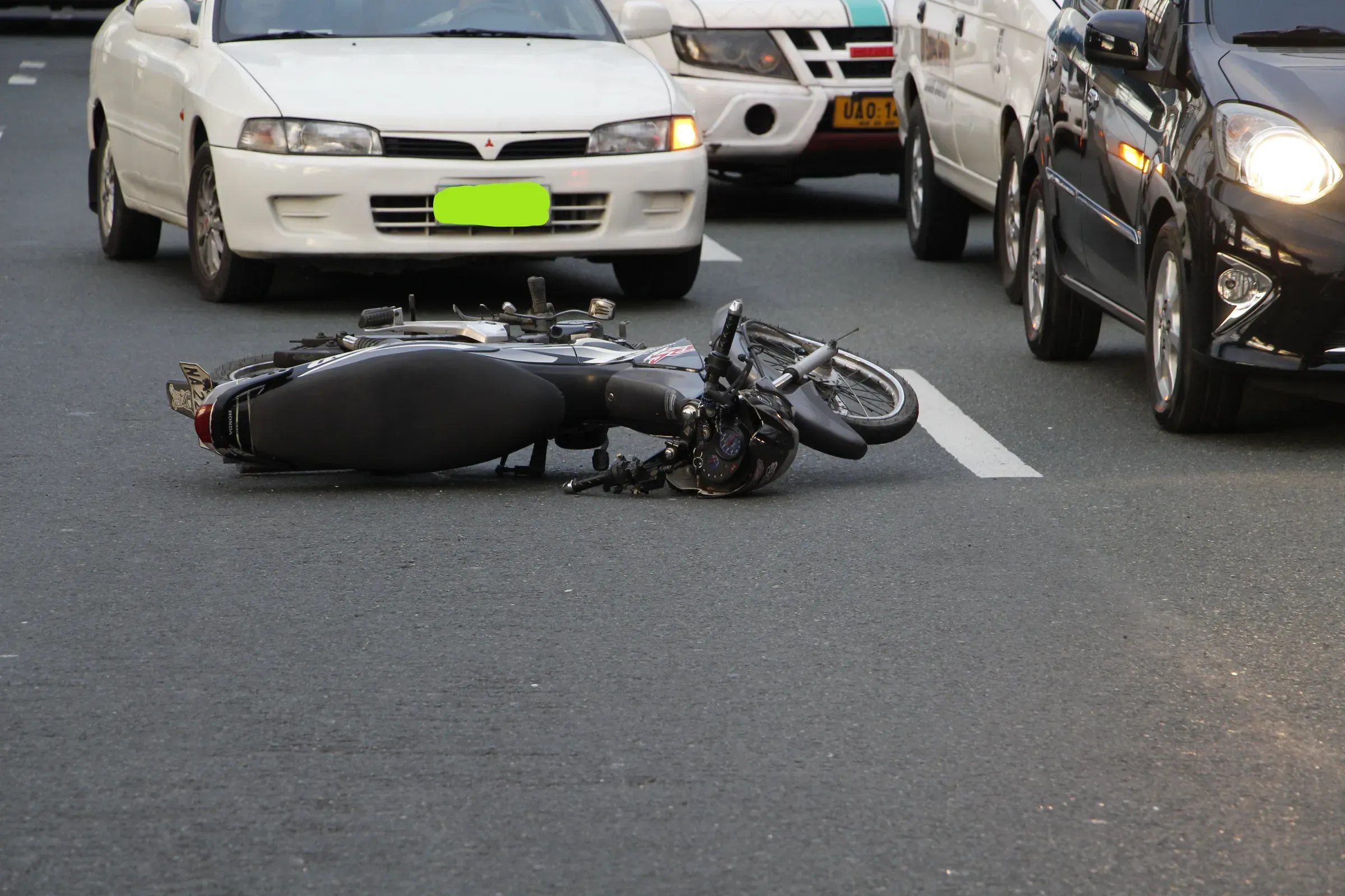 Motorcyclist riding through an urban roadway