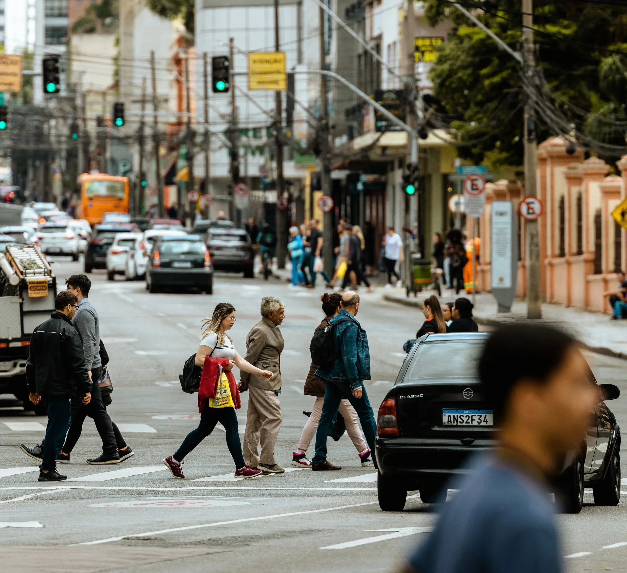 Pedestrian crossing a marked city crosswalk