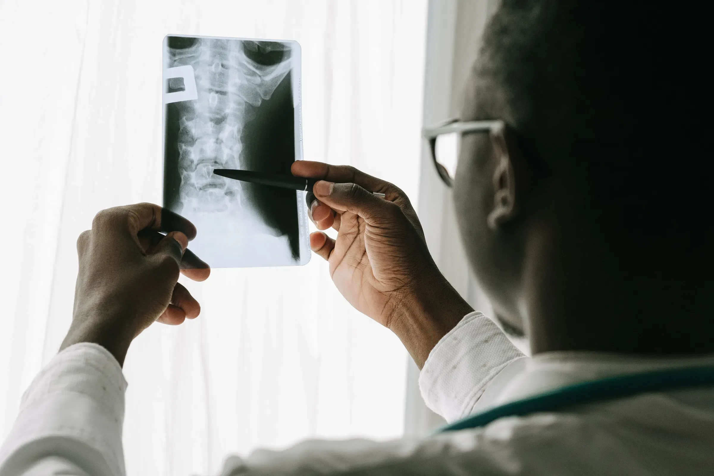 Patient discussing spinal imaging with a clinician
